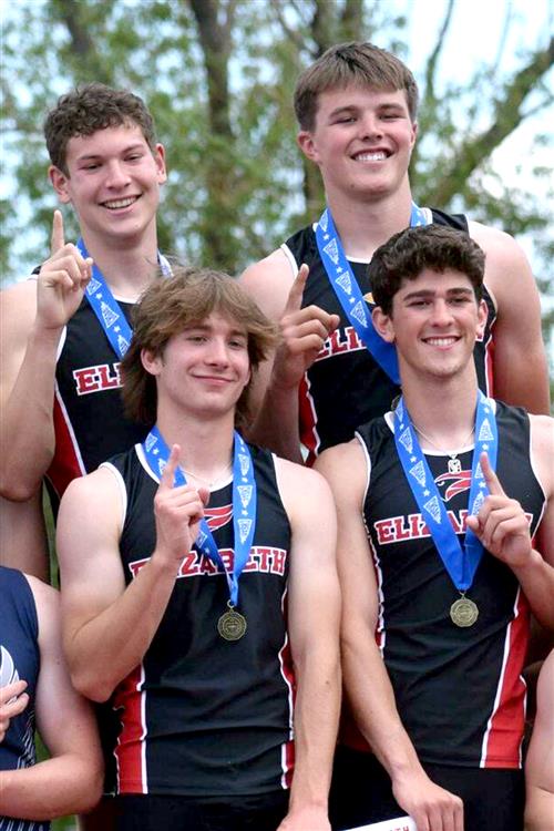 State Champion boys relay team with their medals